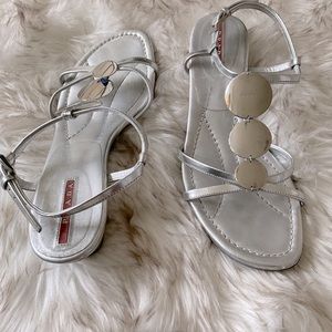Prada silver gladiator sandals with 2 inch wedge. Size 37